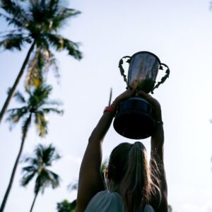 a woman holding a trophy